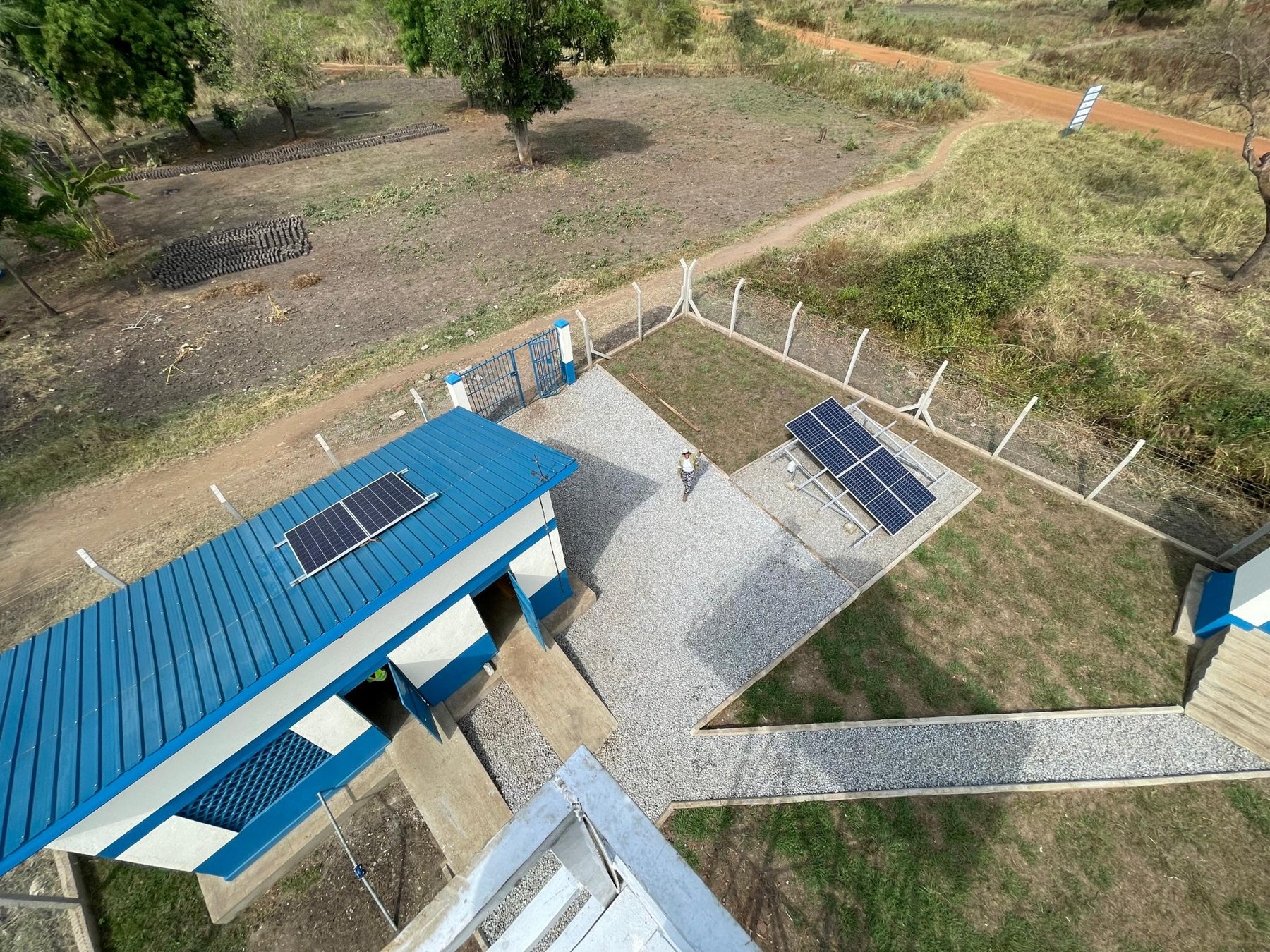 Aerial view of solar panels and water supply infrastructure